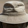 Round crop of a sun-faded canvas safari hat brim